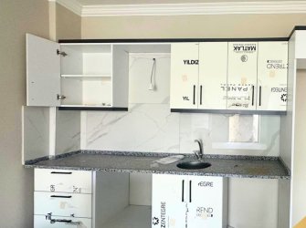 GÜLLÜK MERKEZDE DENİZ MANZARALI BAHÇE KULLANIMLI DAİRE