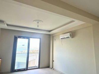 GÜLLÜK MERKEZDE DENİZ MANZARALI BAHÇE KULLANIMLI DAİRE