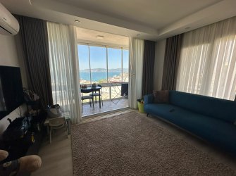 PANORAMİK DENİZ MANZARALI FULL EŞYALI 1+1 DAİRE